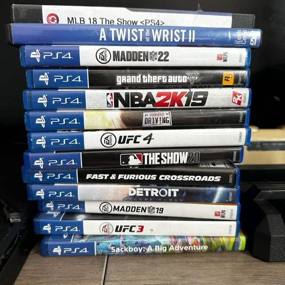 Sony PlayStation 4 Console with Games and 2 controllers - Black